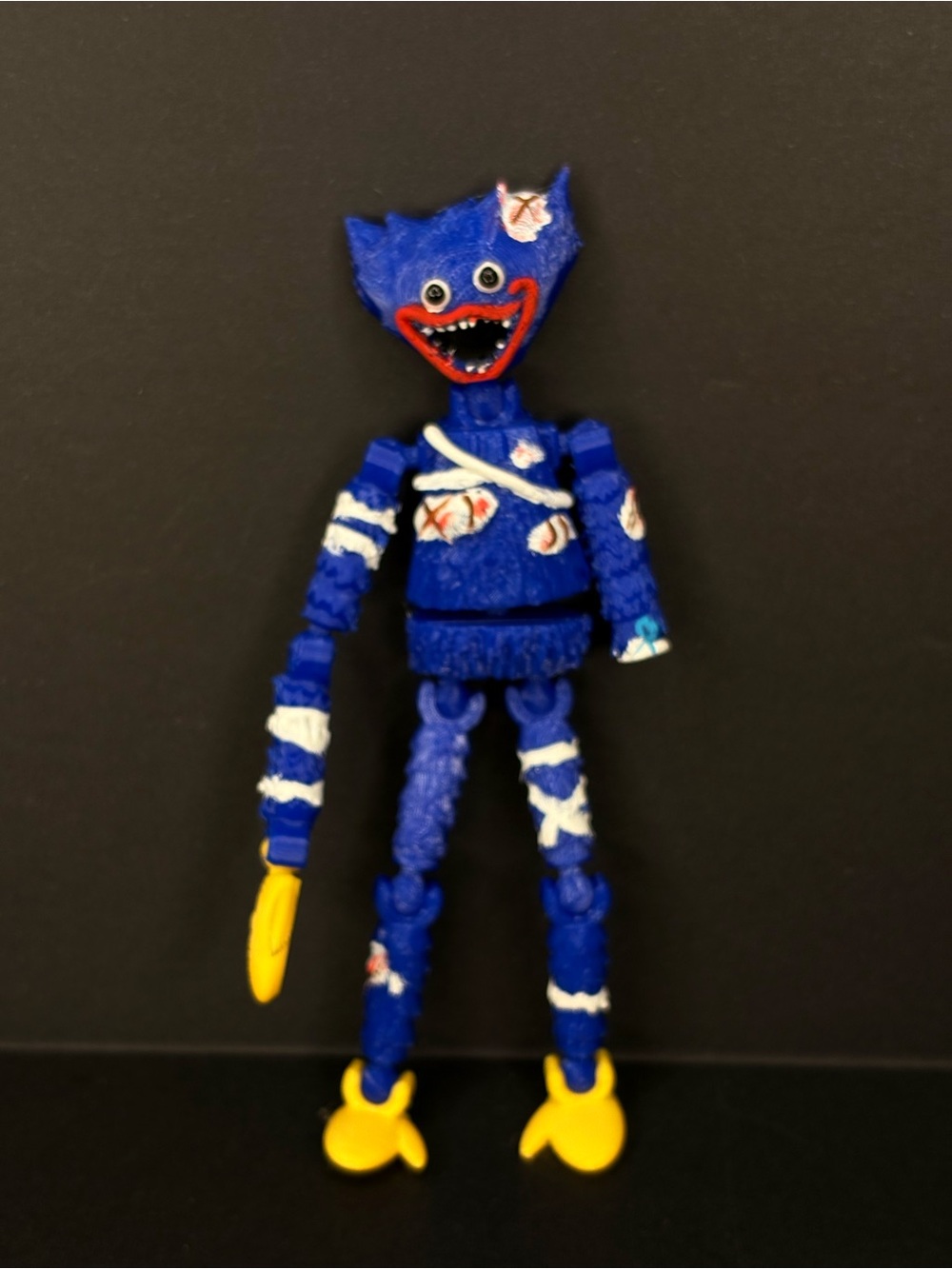Wounded huggy Wuggy articulated figure